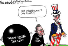 A kneeling judge attaches a ball and chain to Uncle Sam's ankle. The ball reads "Trump above the law." The judge asks Uncle Sam, "Any independence day plans?"