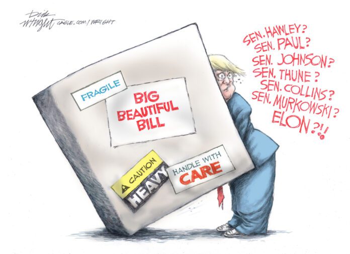 296654 Donald Trump attempts to move a box, marked with stickers reading,